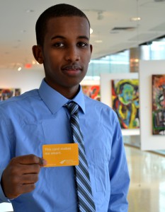 Libcard Month Photo Student holds library card