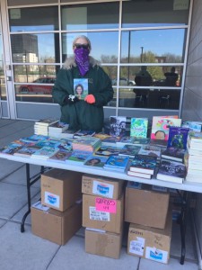 HPL Childrens Librarian Denise Martens distributing books