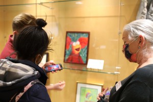 QR codes on each piece of art can be scanned to learn more about the artists.